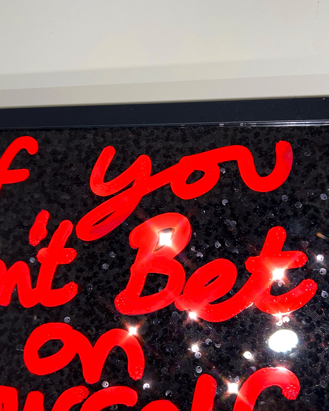 Bet on yourself. Extremely hot orange ink over black sequins. Medium.