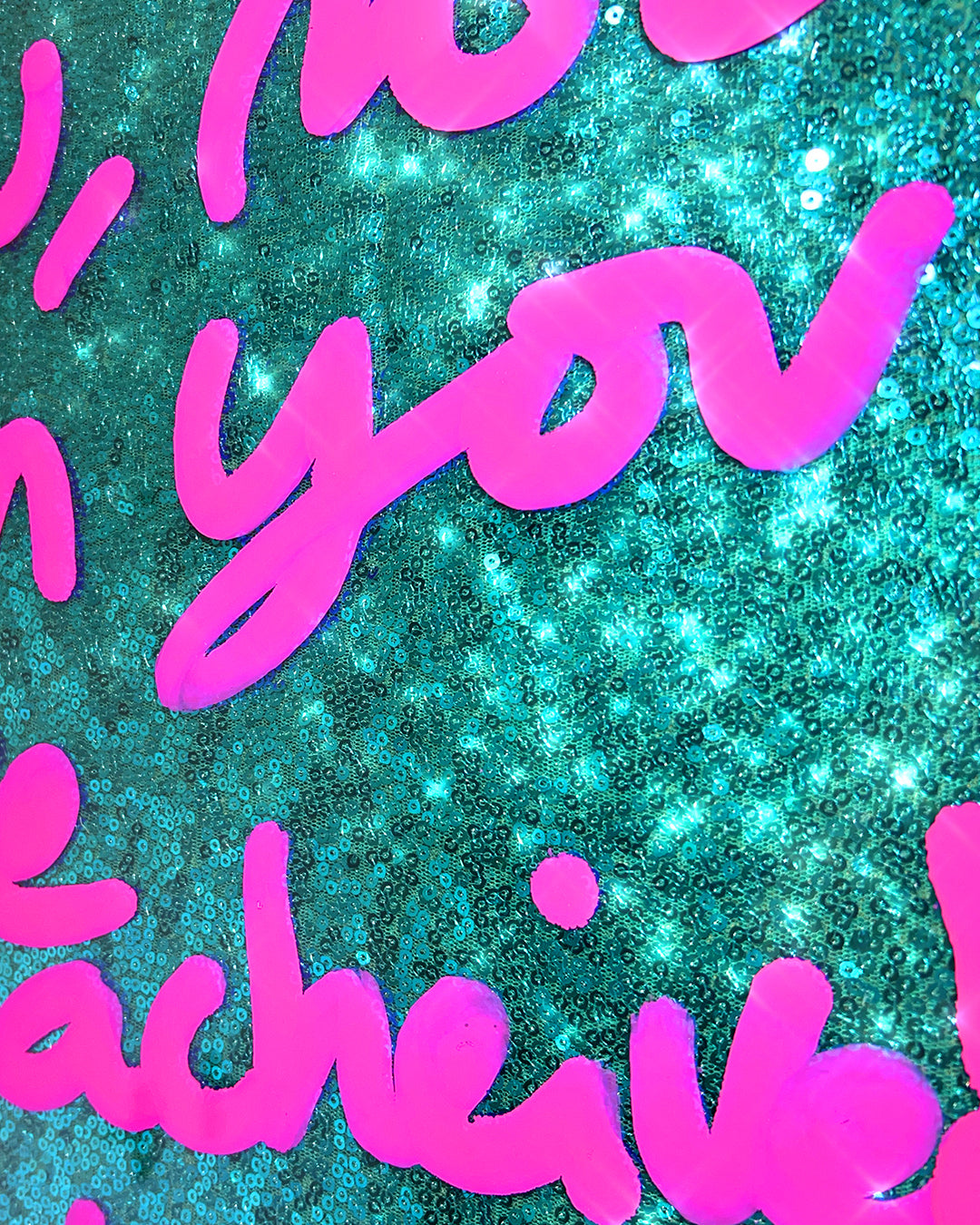 Life is now. Pink ink over turquoise sequins.