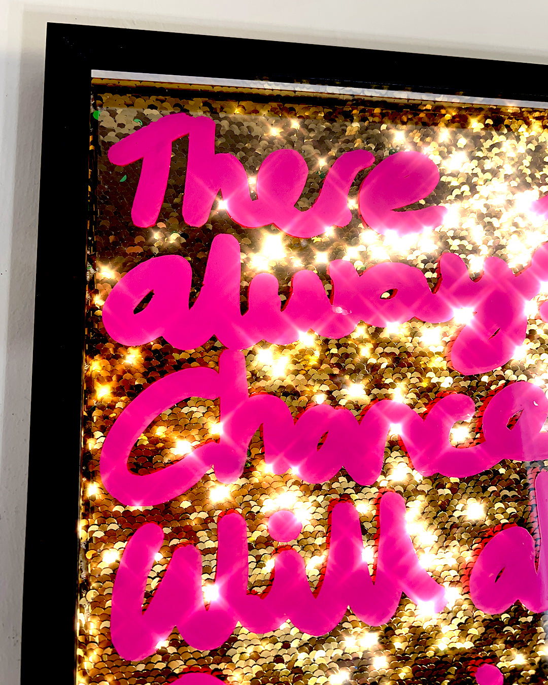 Excellently. Pink ink over gold sequins.