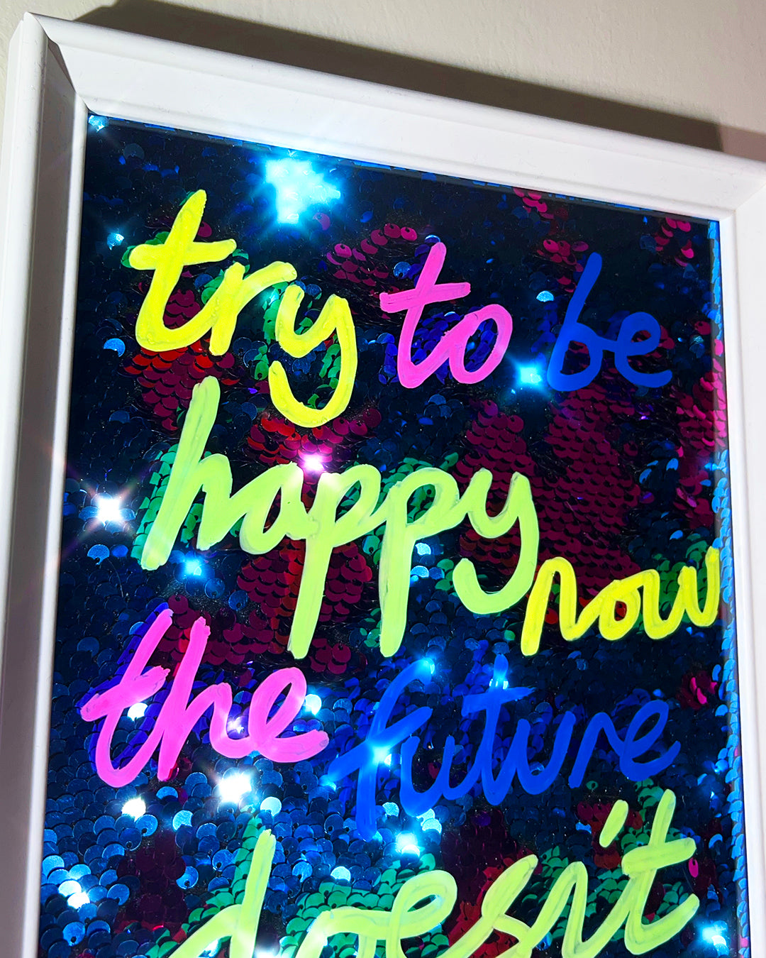 Happy now. Bright inks over blue/pink sequins. Extra Small.