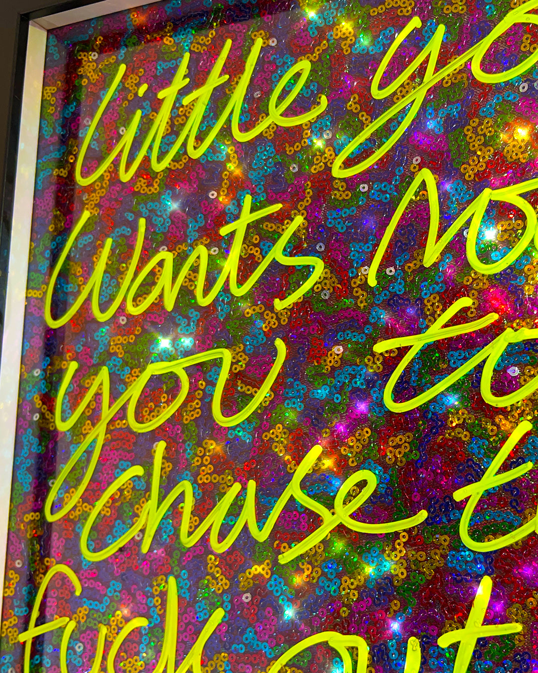 Little you. Yellow ink over multi coloured sequins.