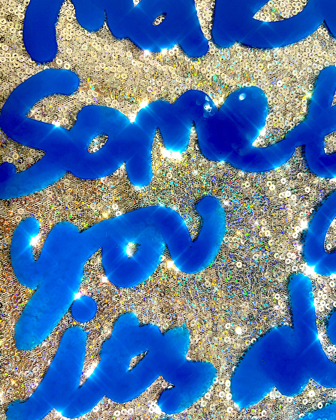 Mission accomplished. Blue ink over iridescent silver sequins.