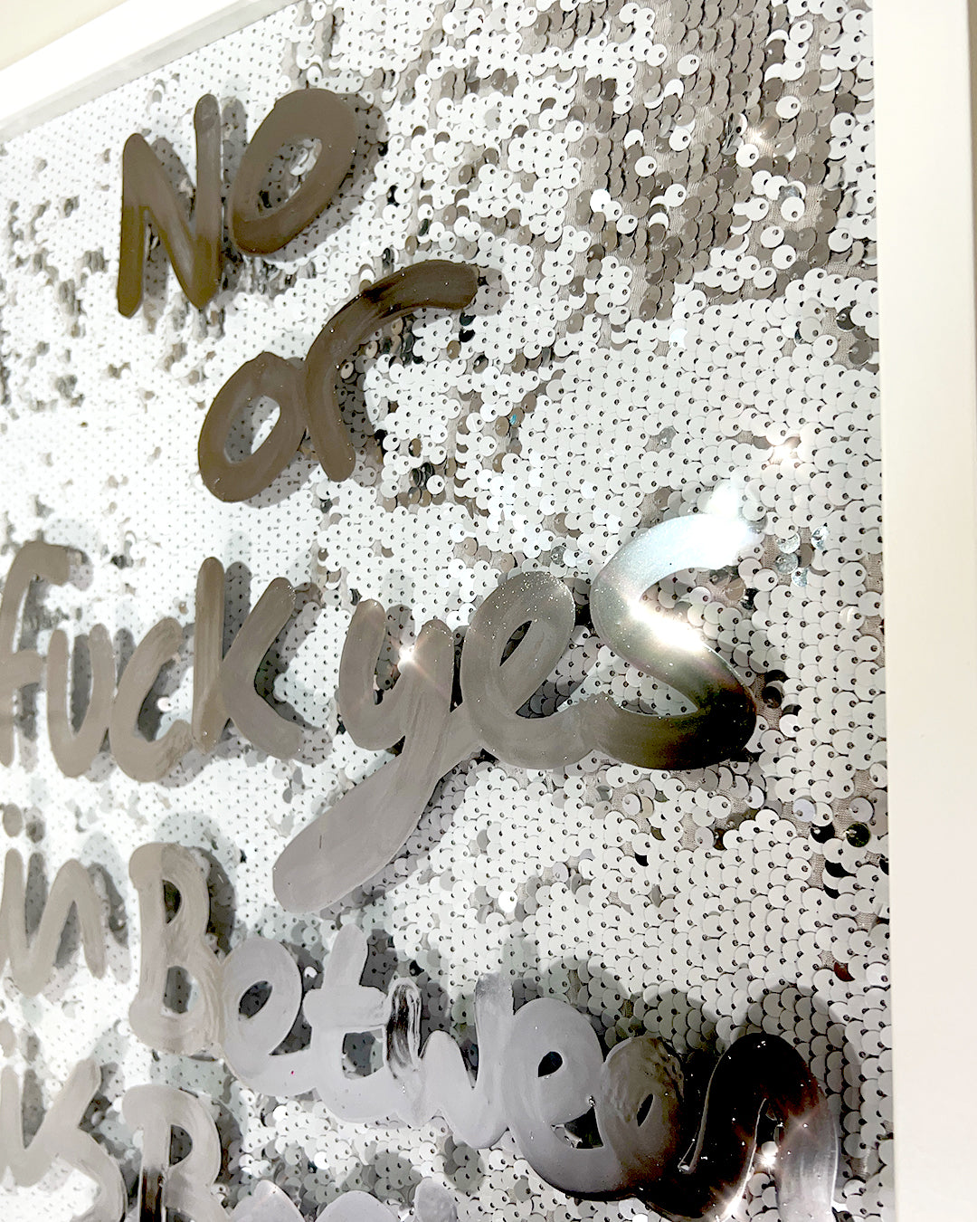 Or fuck yes. LIquid chrome ink over white silver sequins.