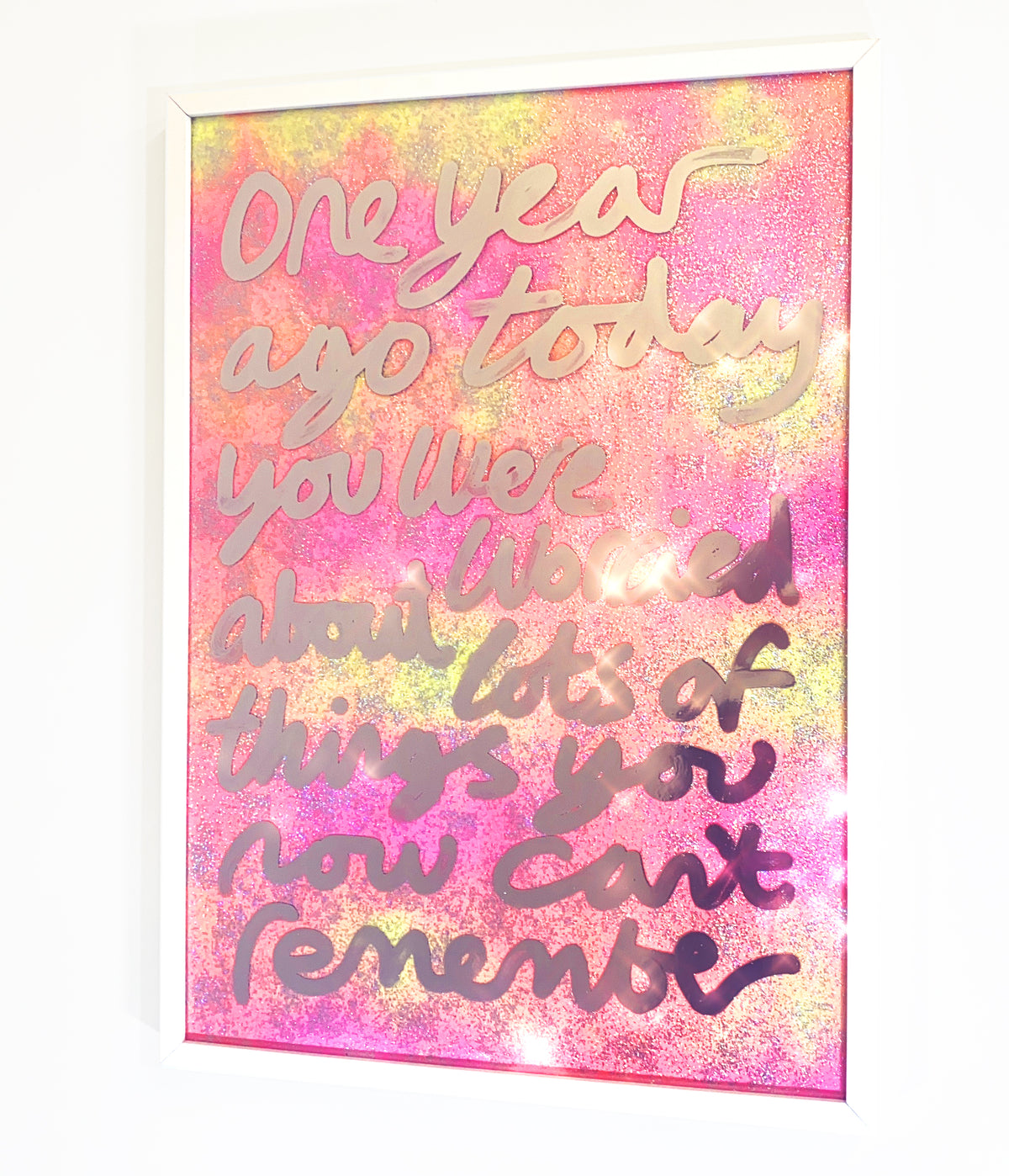 One year ago, liquid chrome ink over sparkling yellow/orange/pink fabric..