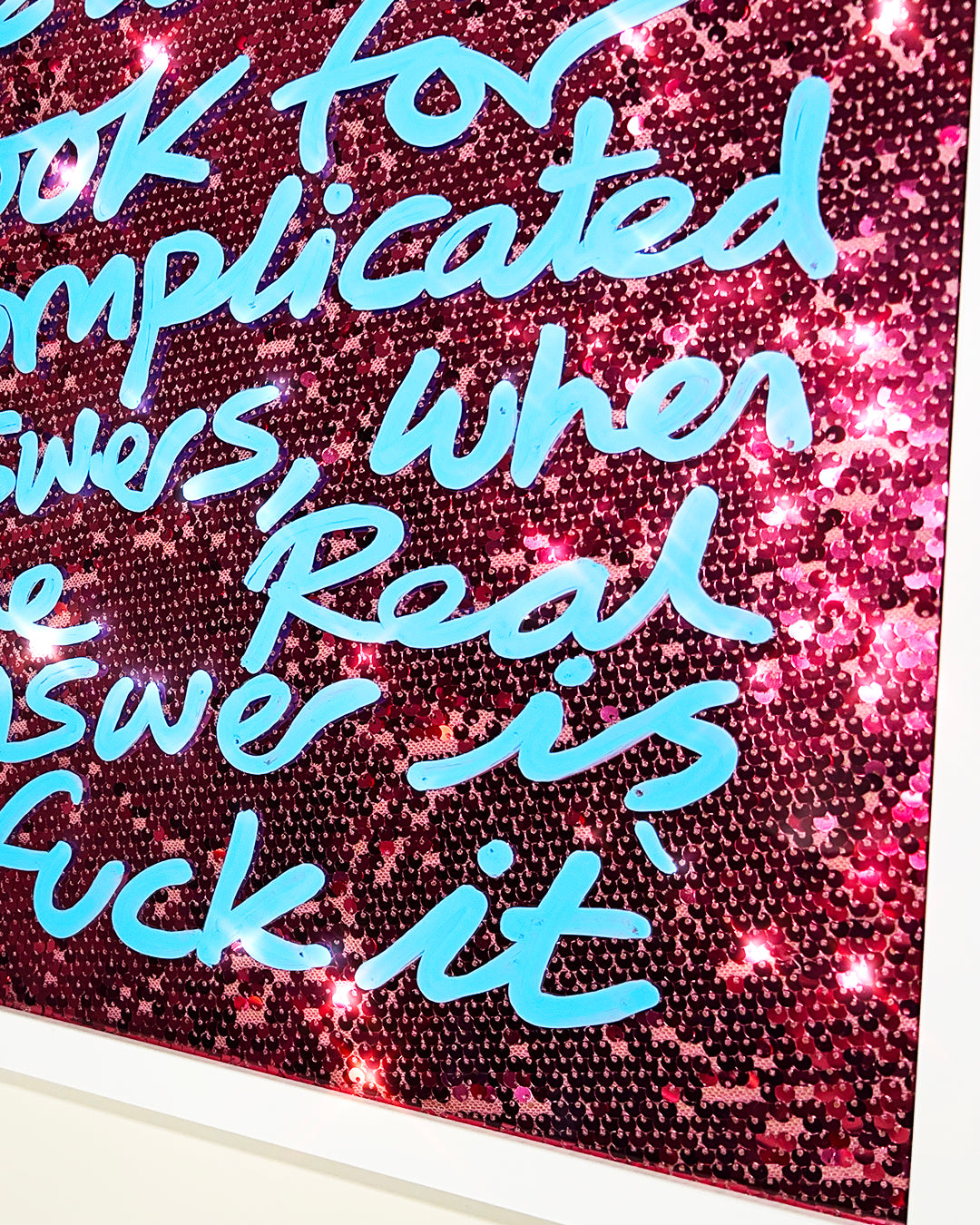Real answer. Sky blue ink over pink sequins. Medium.