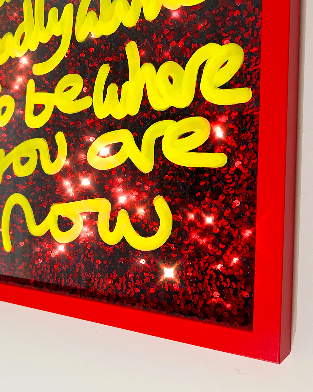 Badly wanted. Sunshine yellow ink over red sequins. Medium.