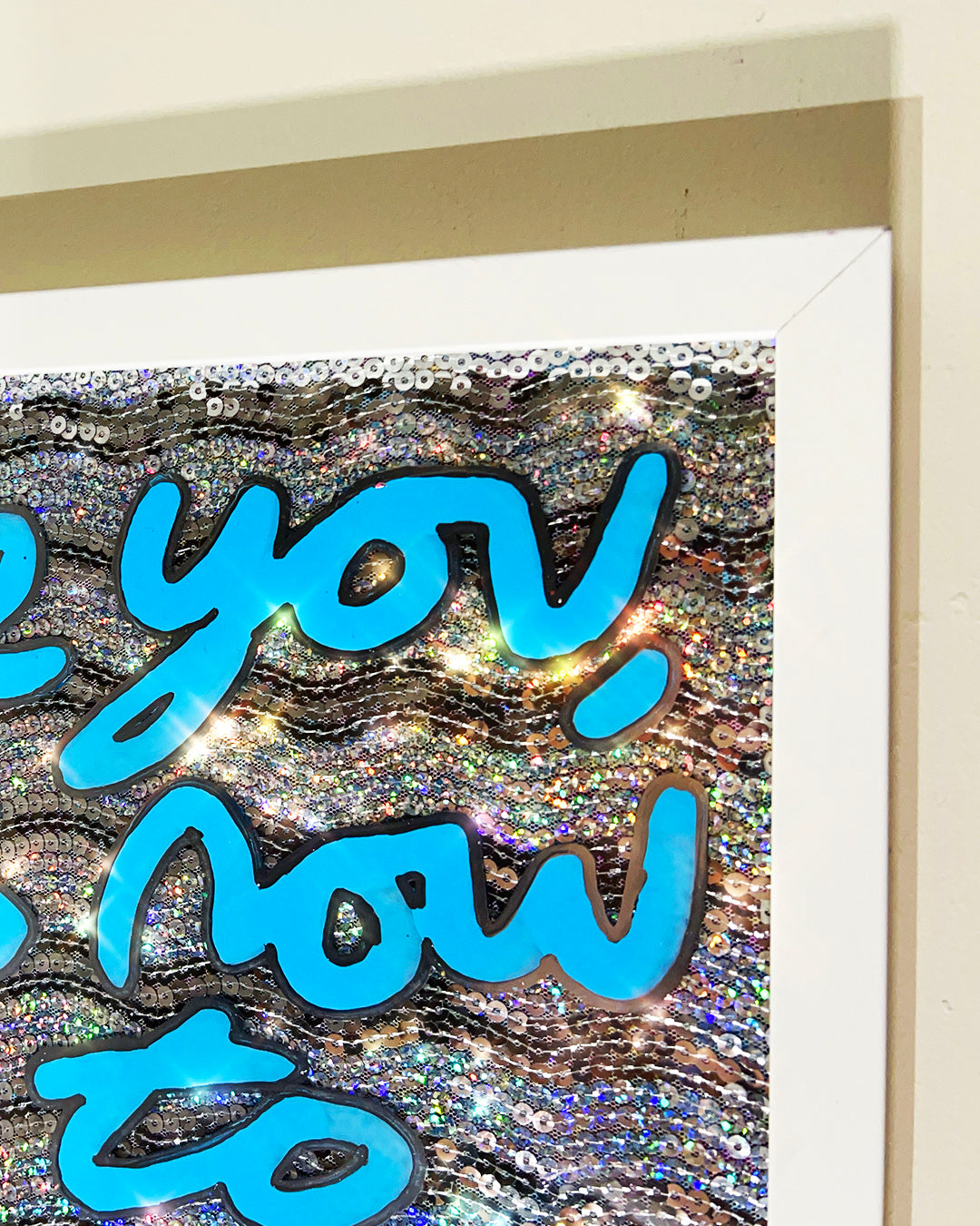 Little you. Sky blue ink over iridescent silver sequins. Medium.