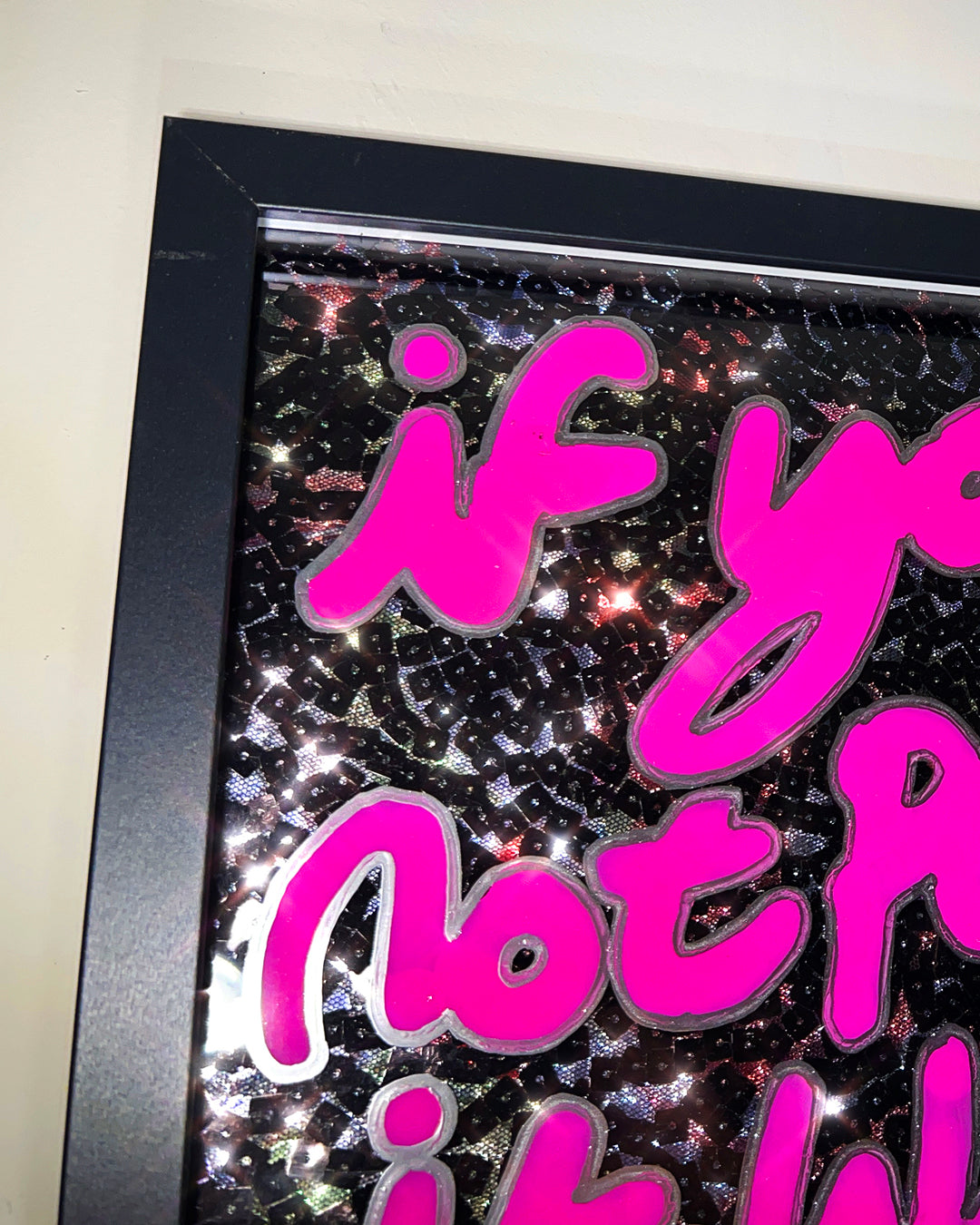 Playful. Pink ink with liquid chrome over black sequins. Medium.