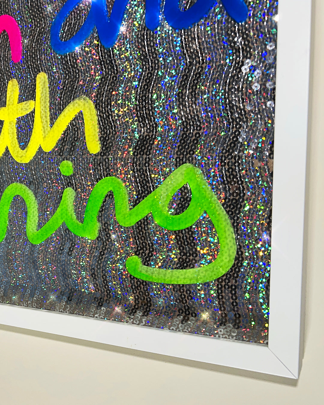 Often and with meaning. Multicoloured ink over iridescent silver sequins. Large.