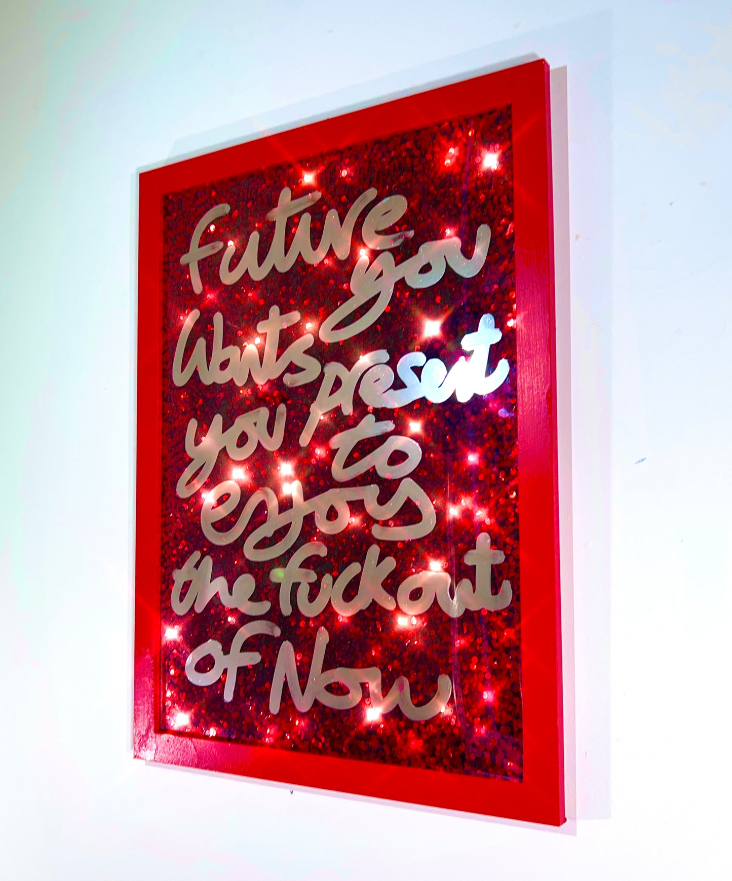 Future you. Liquid chrome ink, over Red Sequins.