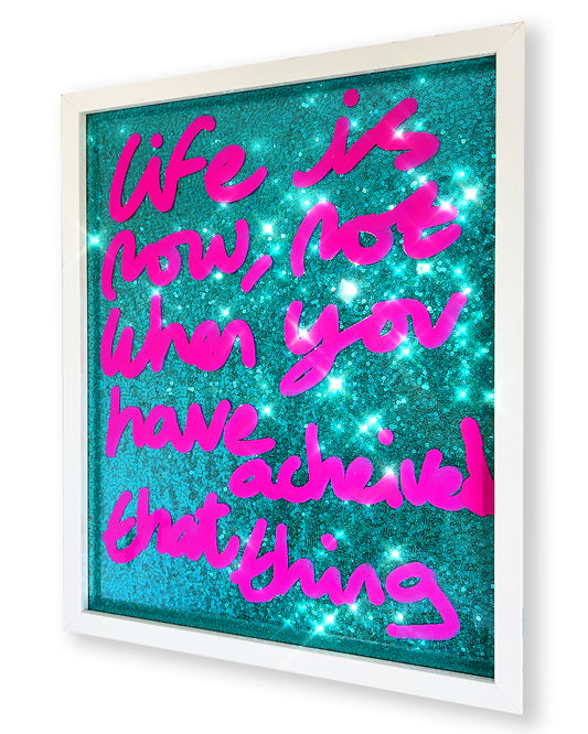 Life is now. Pink ink over turquoise sequins.