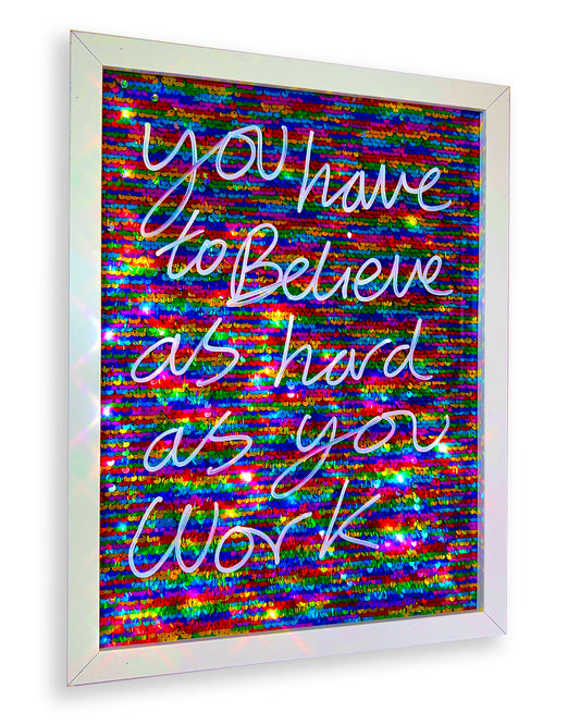 Believe. White ink over multi coloured sequins.