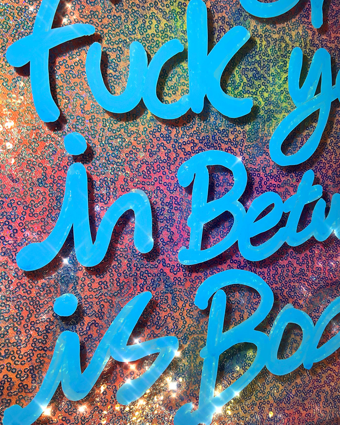 In between is boring.  Blue ink over lilac and multicoloured sequins. Medium.