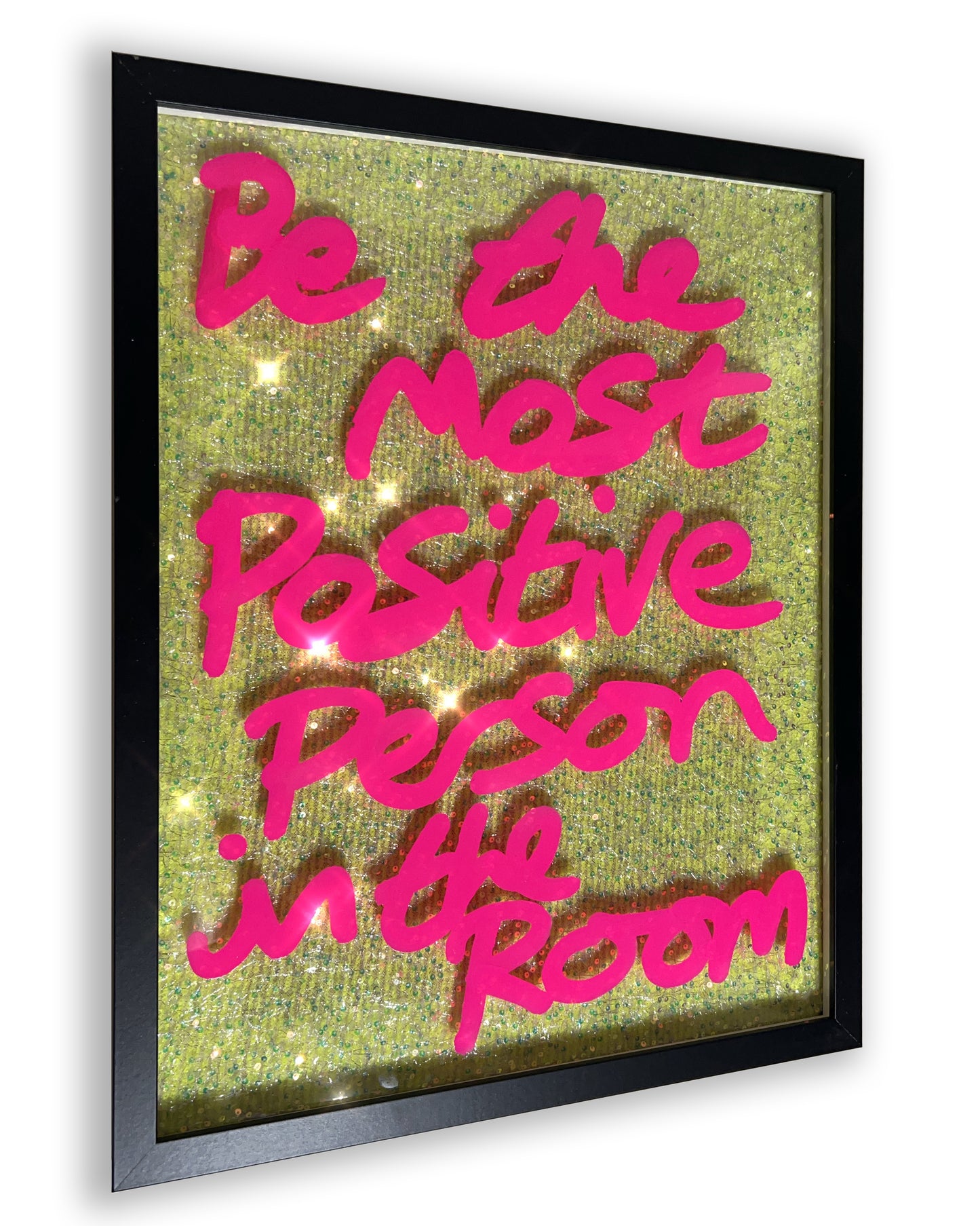Positive person. Hot pink ink over muted neon yellow sequins. Medium.