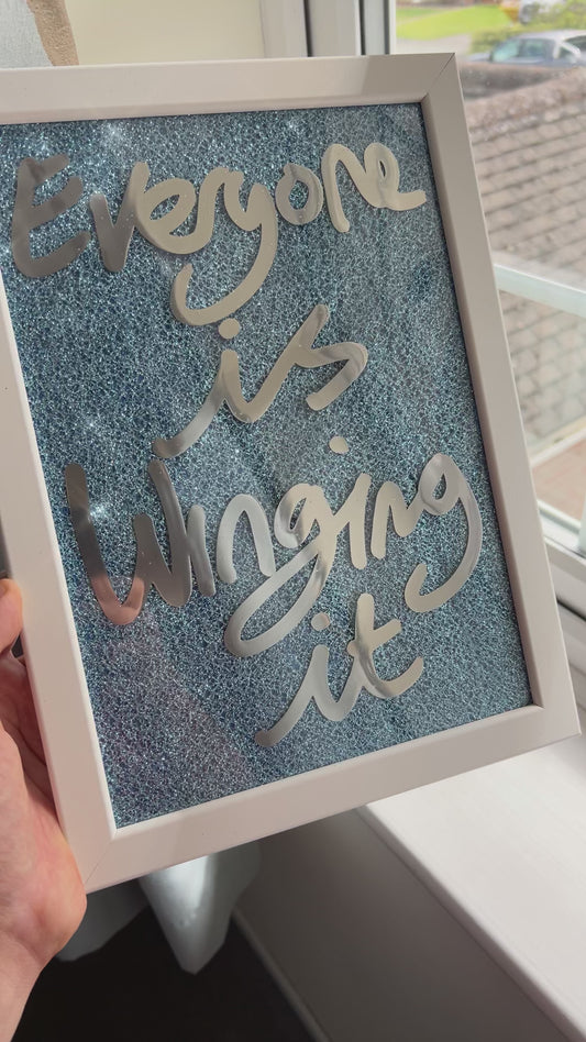 Winging it. Liquid chrome over blue sparkling fabric. Extra Small.