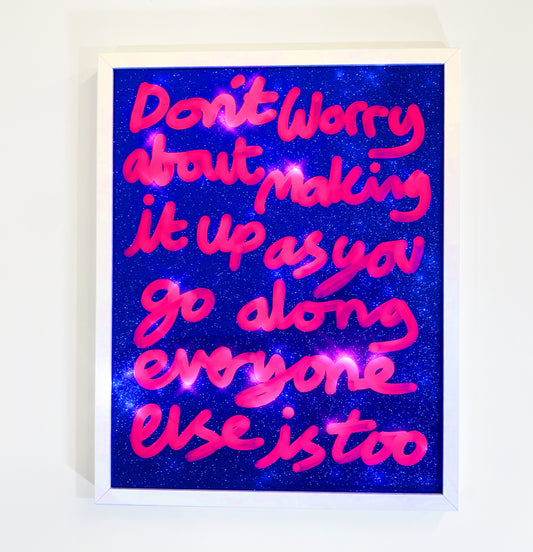 Making it up, neon pink ink over blue glitter material.