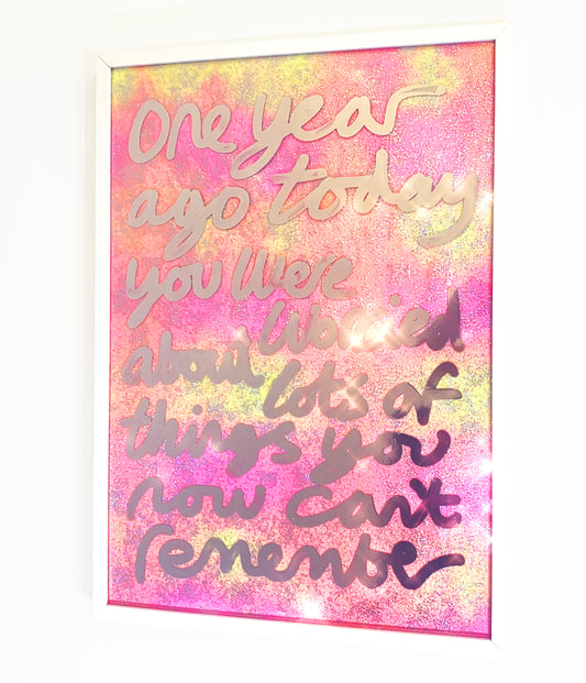 One year ago, liquid chrome ink over  sparkling yellow/orange/pink fabric..